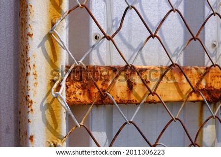 Iron fences, iron plates, and rusted iron gates.