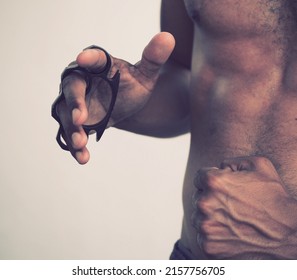 Iron Four Finger, Tiger Hand, Clasp Fist, Defense Ring, Brass Knuckle For Self-defense On Shirtless Man's Hand, Ready To Fight