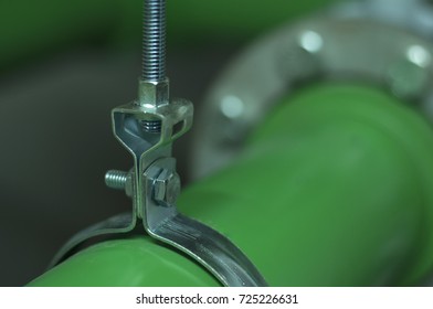 Iron hanger that hanging by stud use for holding PPR pipe (green pipe)