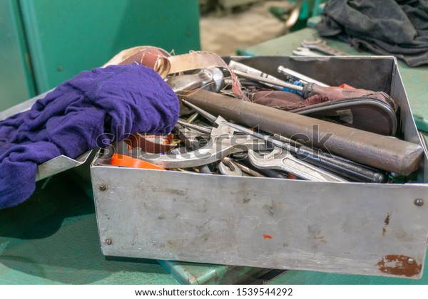 Iron locksmith tool box, wrenches and
screwdrivers for equipment
repair.