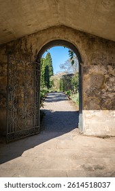 Iron metal gated entrance to a formal garden