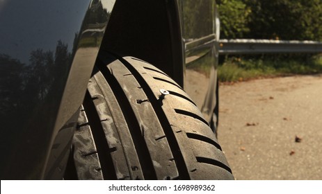 Iron Nail Sticking From Vehicle Tire