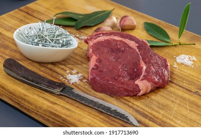 Iron Nails In A Bowl With Red Meat, Garlic, Bay Leaf