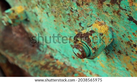 
Iron painted green rusted nut head.