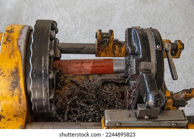 iron pipe beveling machine. Technician is Grooved Steel pipe. Fire fighting pipe groove Install sprinkler system. Worker cutting iron bars. - Shutterstock ID 2244895823