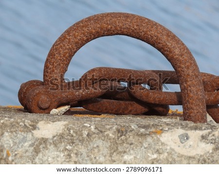Iron ring and chain in a harbor 