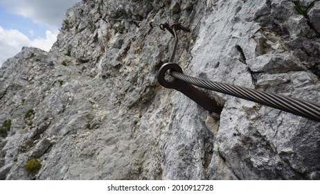 Iron road also known as a via Ferrata or Klettersteig in Mountains in Slovenia - Shutterstock ID 2010912728