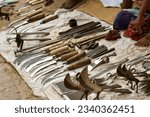 Iron tools for kitchen, farming, construction and other purposes are on display in a remote village blacksmith