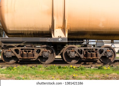 Iron wheels of freight train on sunny spring day