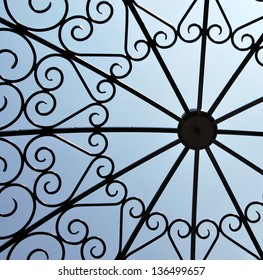 Iron Work Heart Pattern Against Blue Sky