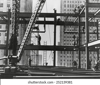 Iron workers raise steel at 32nd floor of the Esso Building in New York City. 1954.