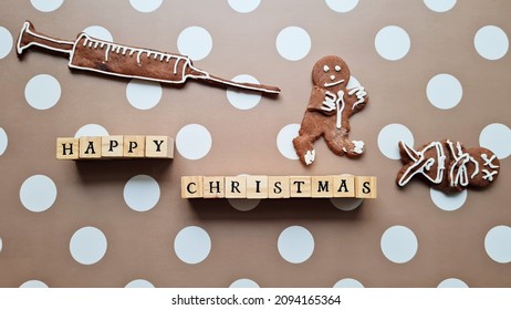 Ironic Or Funny Christmas Gingerbread Cookies. Coronavirus Pandemics. Injection Or Vaccine.  Man Running From Injection. Anti Vaccine Idea. Dead Biscuit Boy Lying On Dot Paper.