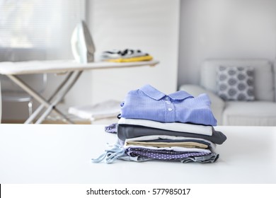 Ironing clothes on ironing board