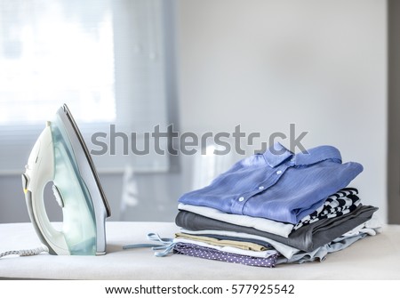 Ironing clothes on ironing board