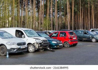 IRPIN, UKRAINE - April 27, 2022: Civil Cars Which Were Shot Up By Russian Soldiers During Evacuation Of Unarmed Peoples From War Zone In Russian Invasion Of Ukraine, Car Graveyard 
