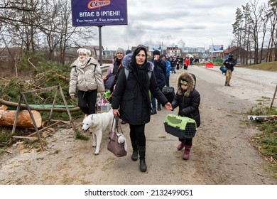 IRPIN, UKRAINE - Mar. 05, 2022: War in Ukraine. Women, old people and children evacuated from Irpin town was transferd to Kyiv by Kyiv territorial defense battalion. War refugees in Ukrain