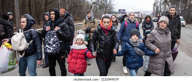 IRPIN, UKRAINE - Mar. 05, 2022: War in Ukraine. Women, old people and children evacuated from Irpin town was transferd to Kyiv by Kyiv territorial defense battalion. War refugees in Ukrain