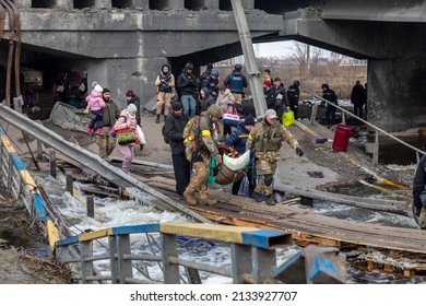 IRPIN, UKRAINE - Mar. 09, 2022: War in Ukraine. Thousands of residents of Irpin have to abandon their homes and evacuate as russian troops are bombing a peaceful city. War refugees in Ukraine