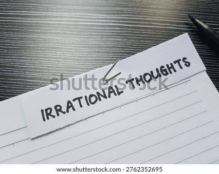 Irrational thoughts writting on table background. 