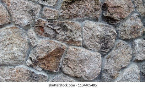 Irregular shape bricks in stone wall texture