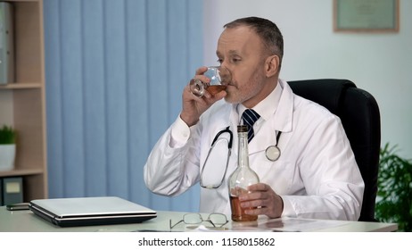 Irresponsible Doctor Drinking Alcohol To Relax At Work, Stressful Occupation