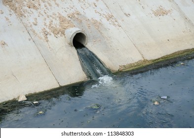 Irrigation canal and drainage waste water pipe in town.