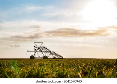 Irrigation equipment in green field - Shutterstock ID 2041570940