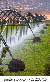 An Irrigation Pivot Watering A Field 