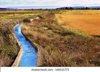 Irrigation Water Channel. Rural Landscape Wheat Fields