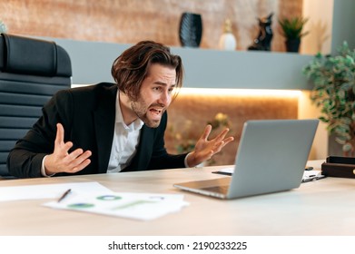 Irritated Angry Caucasian Business Man, Stock Trader, Product Manager, Working In A Modern Office, Yelling To The Laptop, Frustrated By The Disruption Of An Important Deal, Financial Losses, Upset