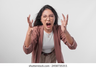 Irritated Asian woman in glasses expressing annoyed, mad, frustrated feelings isolated over white background. - Powered by Shutterstock