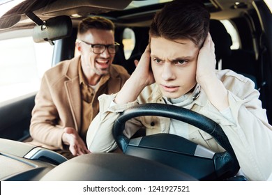 Irritated Father Yelling At Teen Son In Car