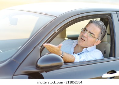  Irritated Male Driving His Car In Traffic - Road Rage Concept