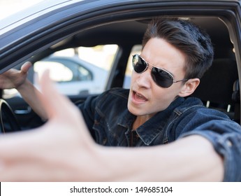 Irritated Young Man Driving A Car. Irritated Driver