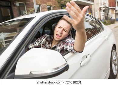 Irritated Young Man Driving A Car. Irritated Driver