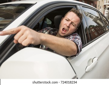 Irritated Young Man Driving A Car. Irritated Driver