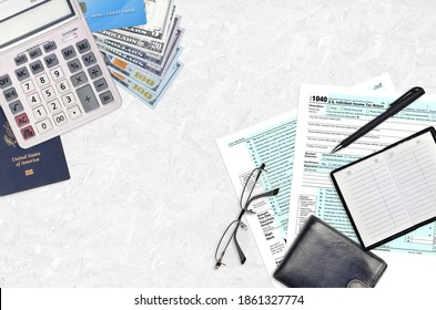 IRS form 1040 Individual income tax return lies on flat lay office table and ready to fill. U.S. Internal revenue services paperwork concept. Time to pay taxes in United States. Top view