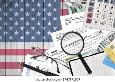 IRS Form 1040NR Nonresident Alien Income Tax Return Lies On Flat Lay Office Table And Ready To Fill. U.S. Internal Revenue Services Paperwork Concept. Time To Pay Taxes In United States
