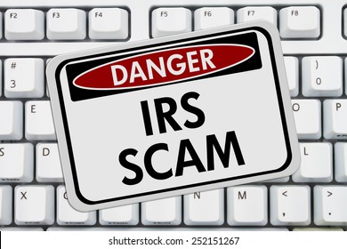 IRS Scam Danger Sign,  A Red And White Sign With The Words IRS Scam On A Keyboard