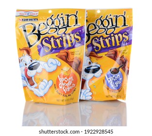 IRVINE, CA - January 05, 2014: Two Packs Of Purina Beggin Strips. One Bacon And Cheese Flavor And One Bacon Flavor Product Are Shown. Purina Is A Leading Pet Food Manufacturer.