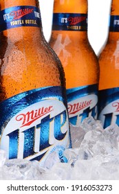 IRVINE, CA - MAY 30, 2014: Closeup of Miller Light beer bottles in ice. Introduced in 1975 Miller Lite was one of the first Reduced Calorie beers to be successful in the American marketplace.