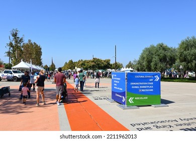 IRVINE, CALIFORNIA - 08 OCT 2022: People Visit Exhibits Along The Time Line At The Irvine Global Village Festival At The Orange County Great Park.