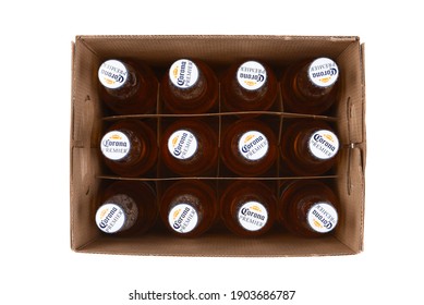 IRVINE, CALIFORNIA - 10 MAR 2020: High angle shot of a 12 pack of Corona Premier bottles with lid off the box.