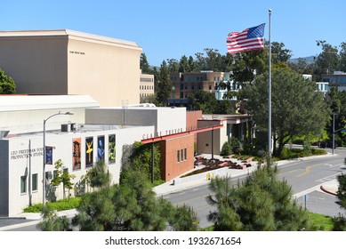 IRVINE, CALIFORNIA - 16 APRIL 2020: The Claire Trevor School Of The Arts And American Flag On The Campus Of The University Of California Irvine, UCI.