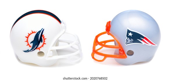 IRVINE, CALIFORNIA - 24 JUNE 2021: Football Helmets Of The Miami Dolphins Vs New England Patriots, Week One Opponents In The NFL 2021 Season