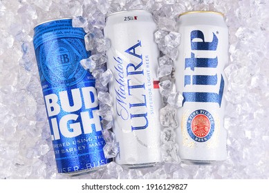 IRVINE, CALIFORNIA - MARCH 29, 2018: Three of the most popular Light beers in a bed of ice. King cans of Bud Light, Michelob Ultra, and Miller Lite.