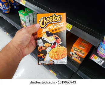 Irvine, California, United States - 09-01-2020: A View Of A Hand Holding A Box Of Cheetos Mac 'N Cheese Bold And Cheesy, Seen At A Local Grocery Store.