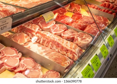 Irvine, California/United States - 03/29/19: Several Varieties Of Pork Cuts In A Glass Display Case At The Meat Department Of A Grocery Store