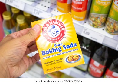 Irvine, California/United States - 08/09/2019: A Hand Holds A Box Of Arm & Hammer Baking Soda At The Grocery Store