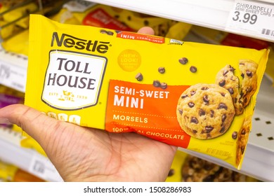 Irvine, California/United States - 08/09/2019: A Hand Holds A Bag Of Nestle Toll House Chocolate Chips At The Grocery Store